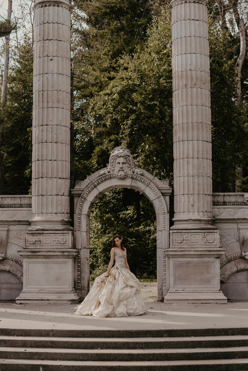 stone arches surround modern bride