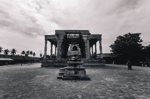 stone building and statue in hindu temple