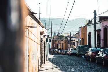 Free Stone Road Lined With Cars Photo — High Res Pictures