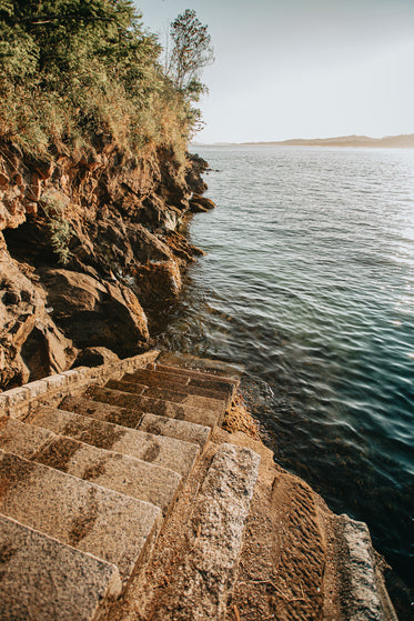 stone steps lead down to the water