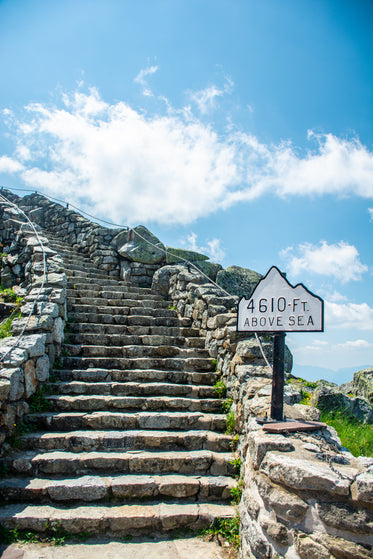 stony steps rise to meet a blue sky