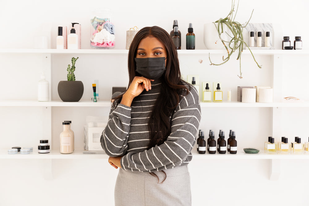 store owner standing with face mask