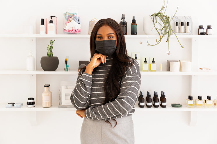 Store Owner Standing With Face Mask