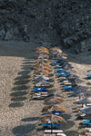 Aerial photography: umbrella shadows on the sand