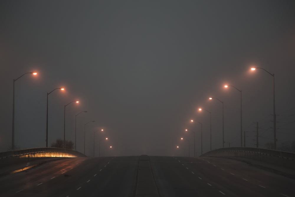 street lights glow in fog