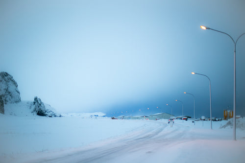 street lights glow in iceland winter