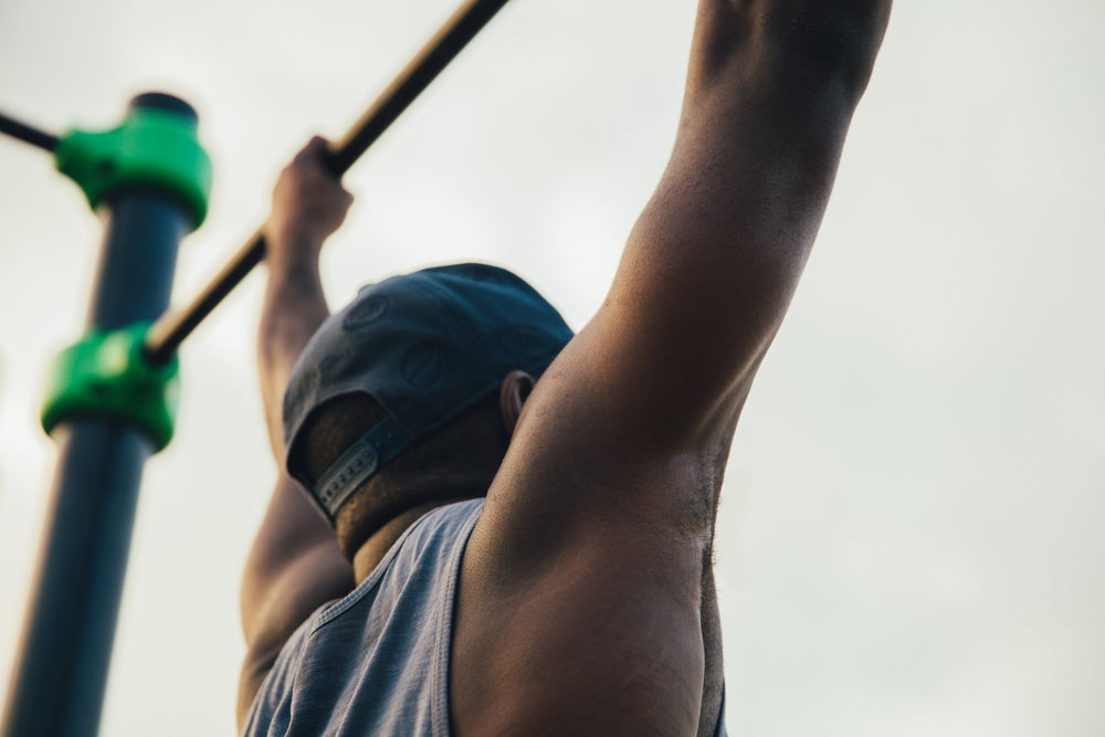 strong man doing pull ups