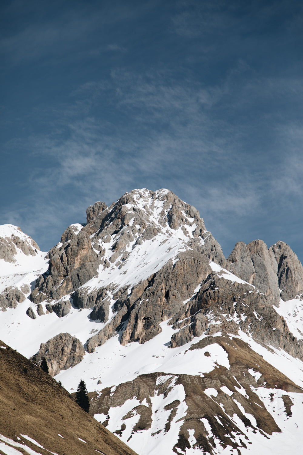 stunning mountain range below blue sky