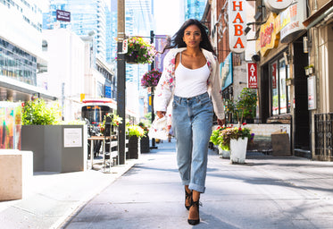summer fashion model walks in urban setting