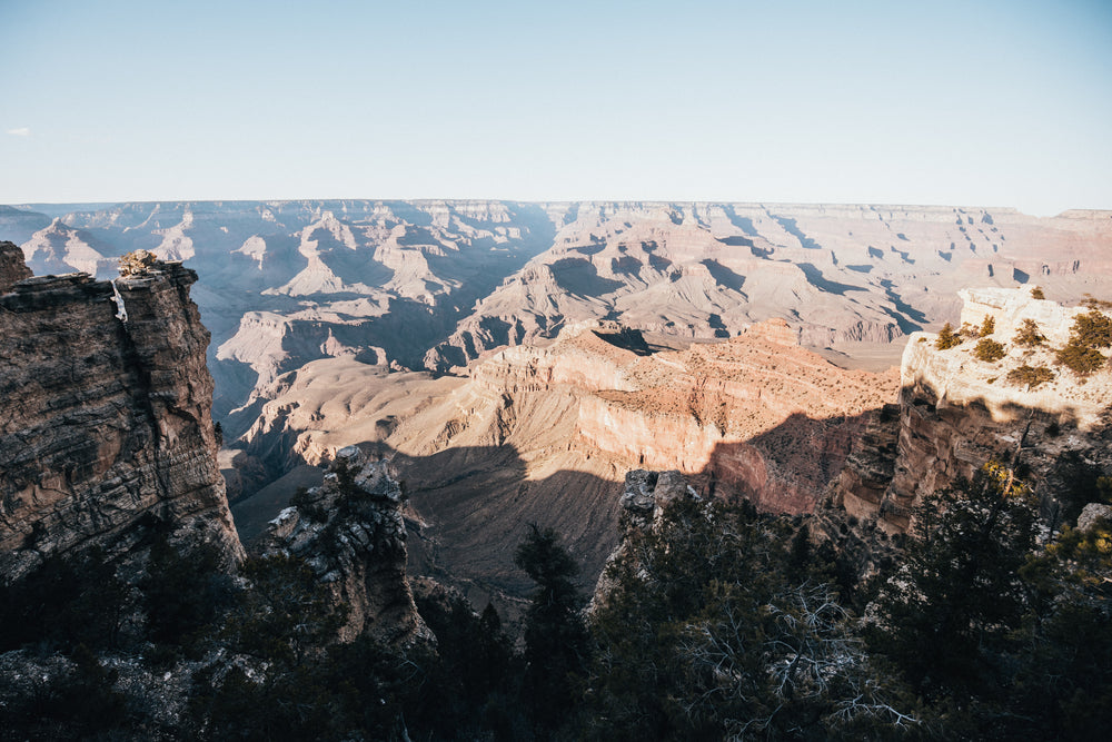 sun and shadows over sprawling canyon