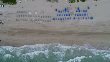 sun loungers lined on the beach