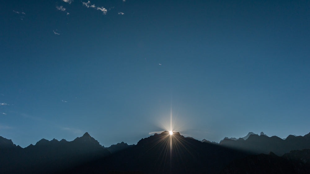 sun over mountain tops