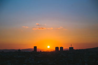 Picture of Sun Setting Over City - Free Stock Photo
