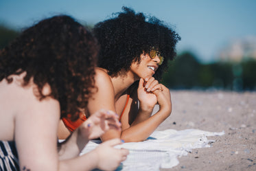 sunbathers enjoy the beach