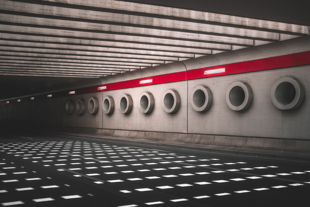 sunlight bleeds through the top of an underpass