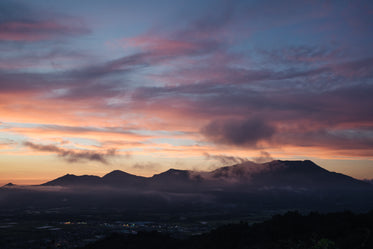 sunrise over the horizon with misty sky