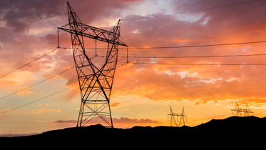 sunset behind power lines