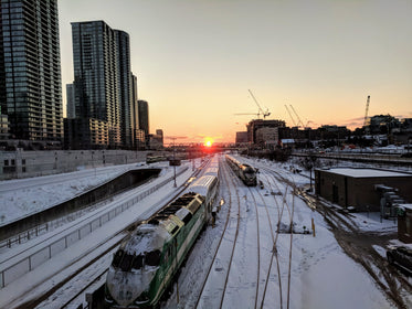sunset over city rail yard