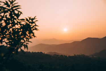 sunset over the mountains in orange light