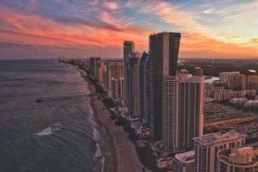 sunset skyscrapers by the sea