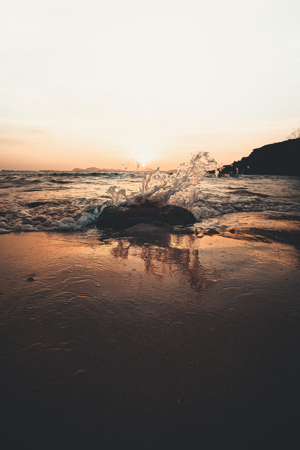 sunset splashing over rocks