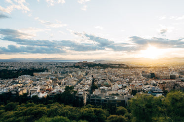 sunsets in an aerial view of a busy city