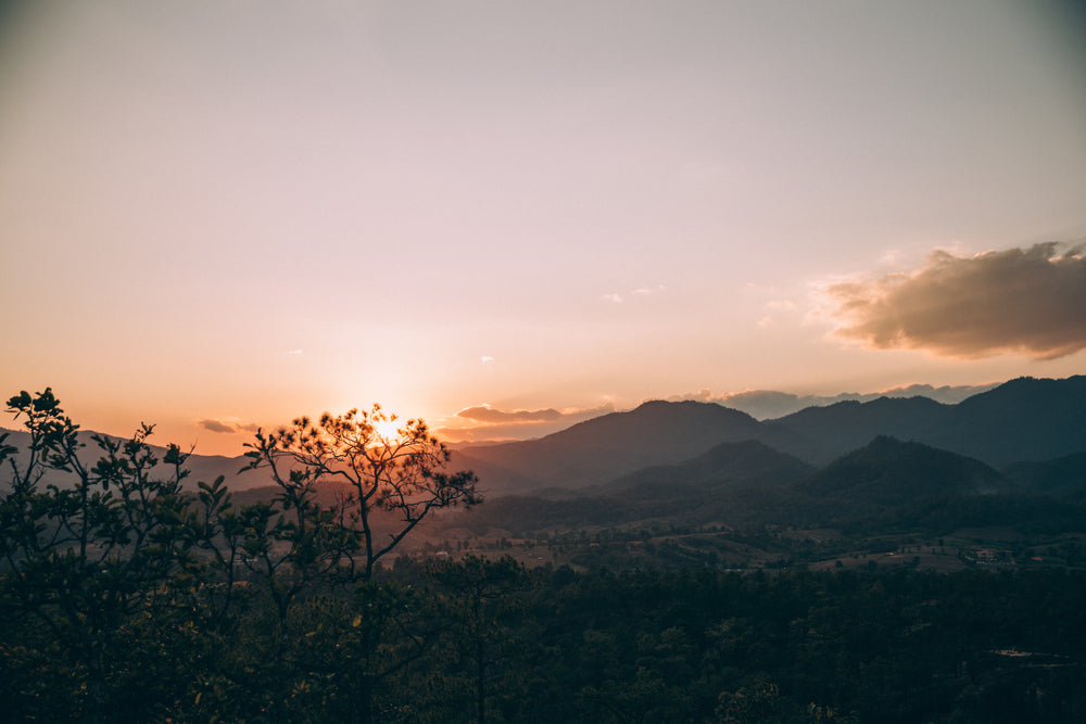 sunsets over thailand mountains