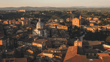 sunsetting over town with terracotta roofs