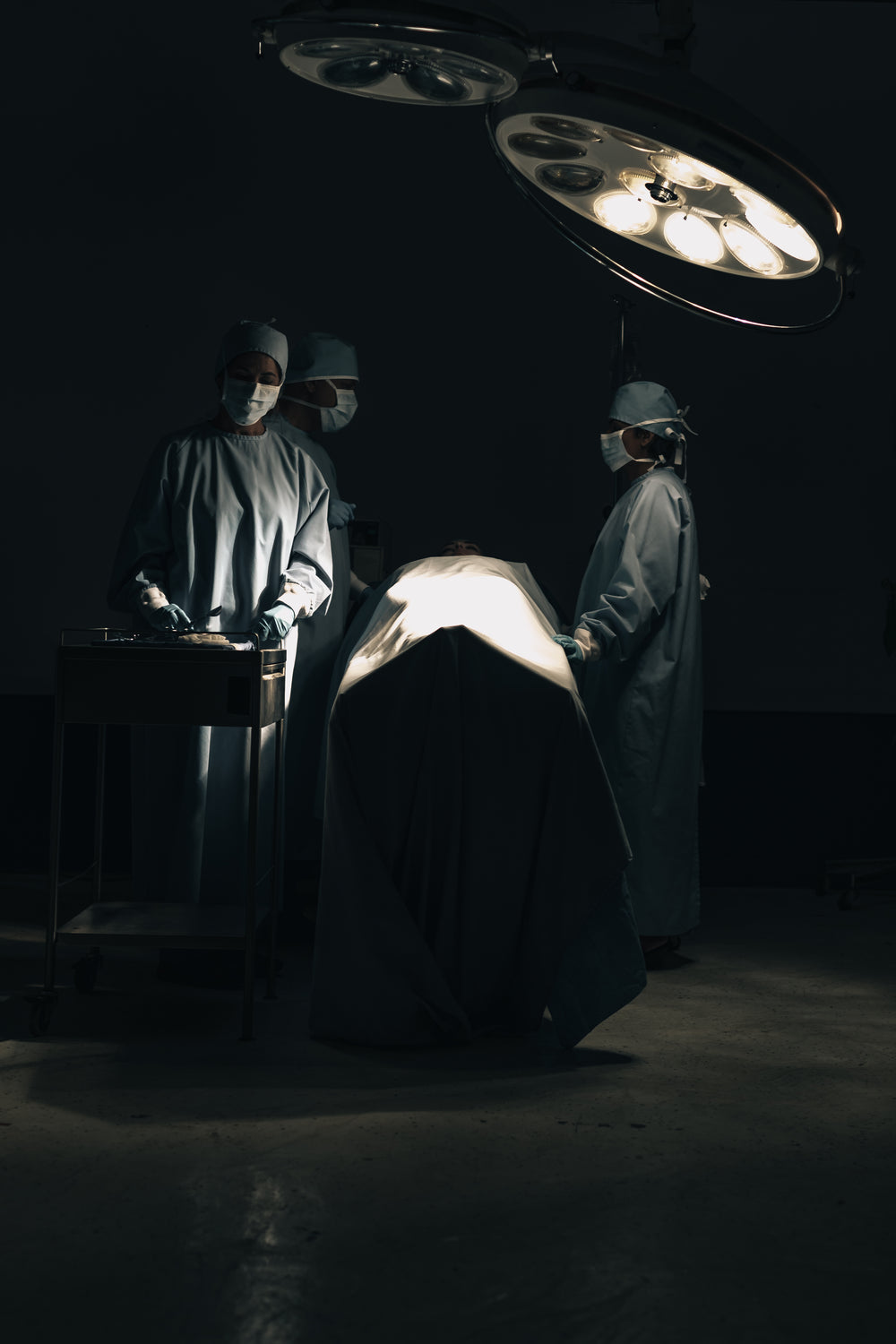 surgeons prepare for surgery in an operating room