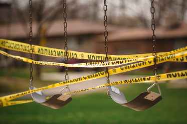 swings wrapped with caution tape