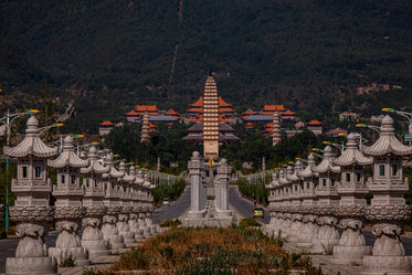 Symmetrical Statues Lining A City Street