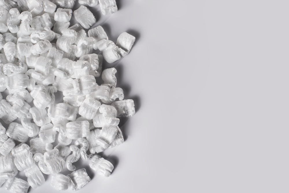 table half filled with packing peanuts