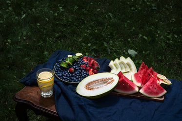 table outdoors with assorted fruits on it