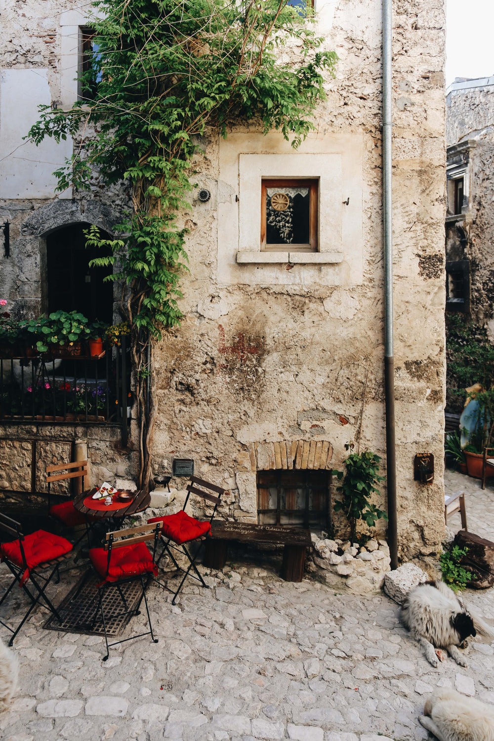 table set by weathered building