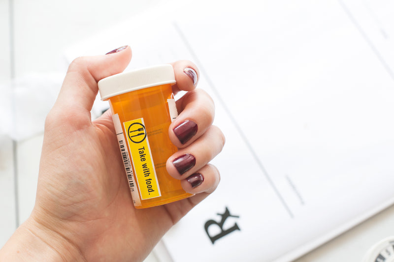 take with food prescription - a woman holding a pill pill pill pill pill pill pill pill pill pill pi