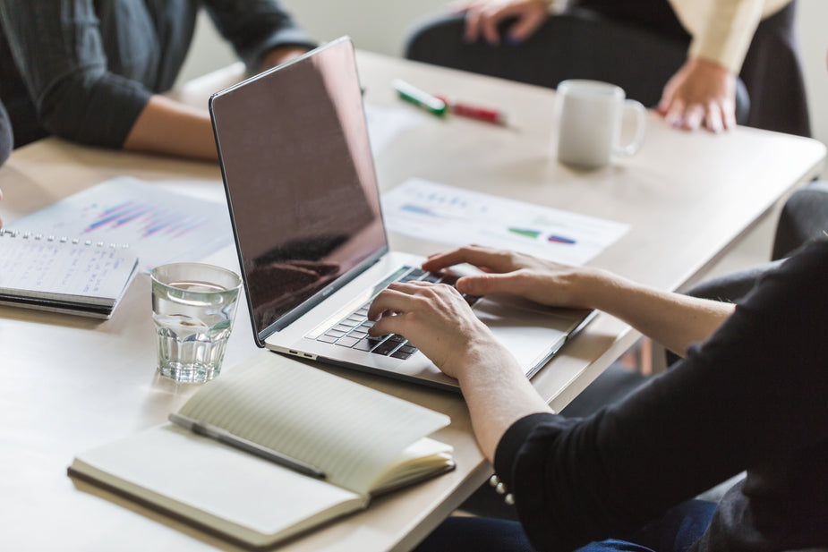 Work Taking Notes Picture of Taking Notes And Working On Laptop — Free Stock Photo