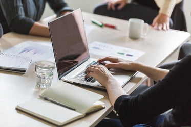 Picture of Taking Notes And Working On Laptop — Free Stock Photo