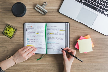 taking notes at desk