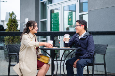 talking over coffee in an outdoor patio