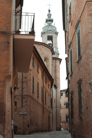 tall brick buildings with a bell tower at the top