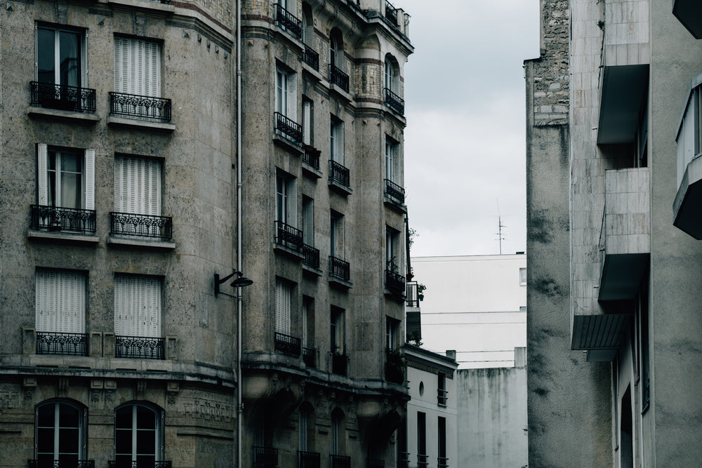 tall building with windows and juliette balconies