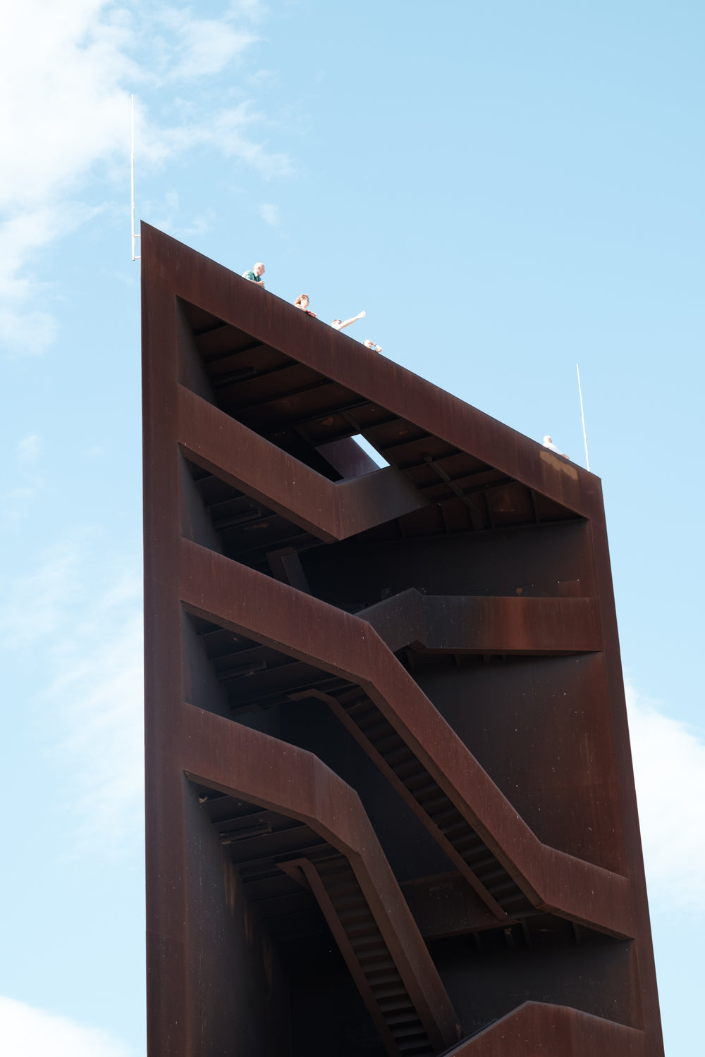 tall metal structure with weaving staircase