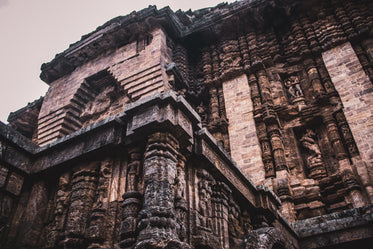 tall stone building with detailed inlaid sculpture