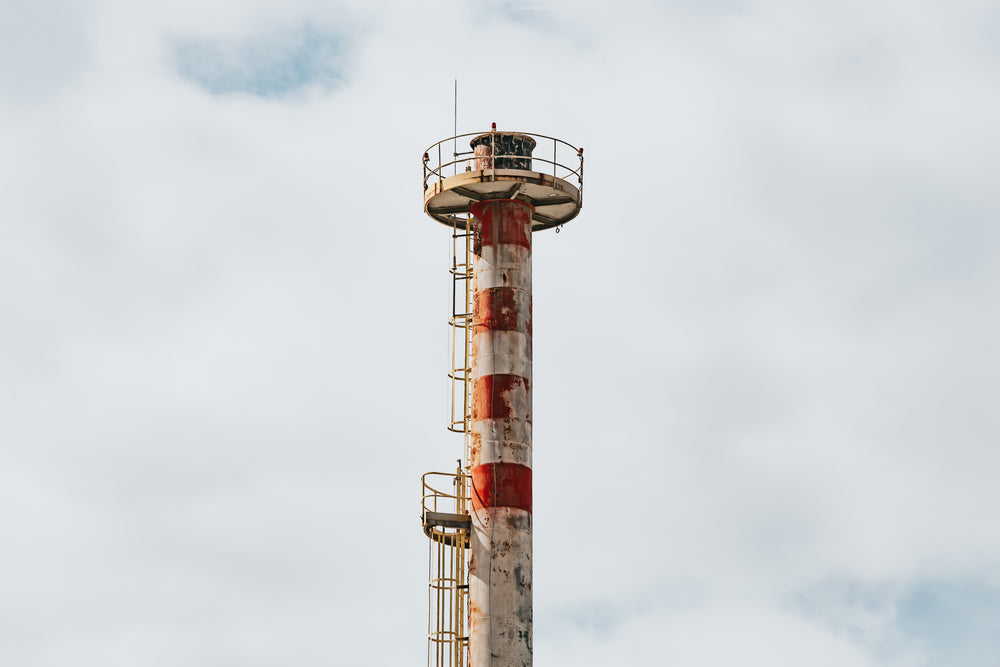 tall weathered tower against a cloudy sky