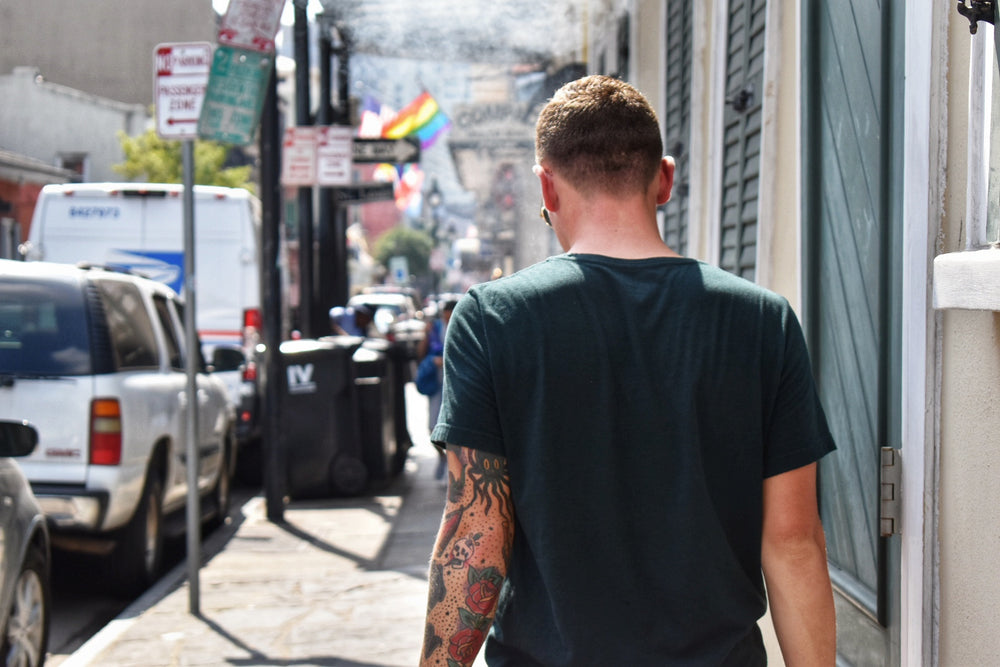 Tattooed Man Takes A Stroll In Summer