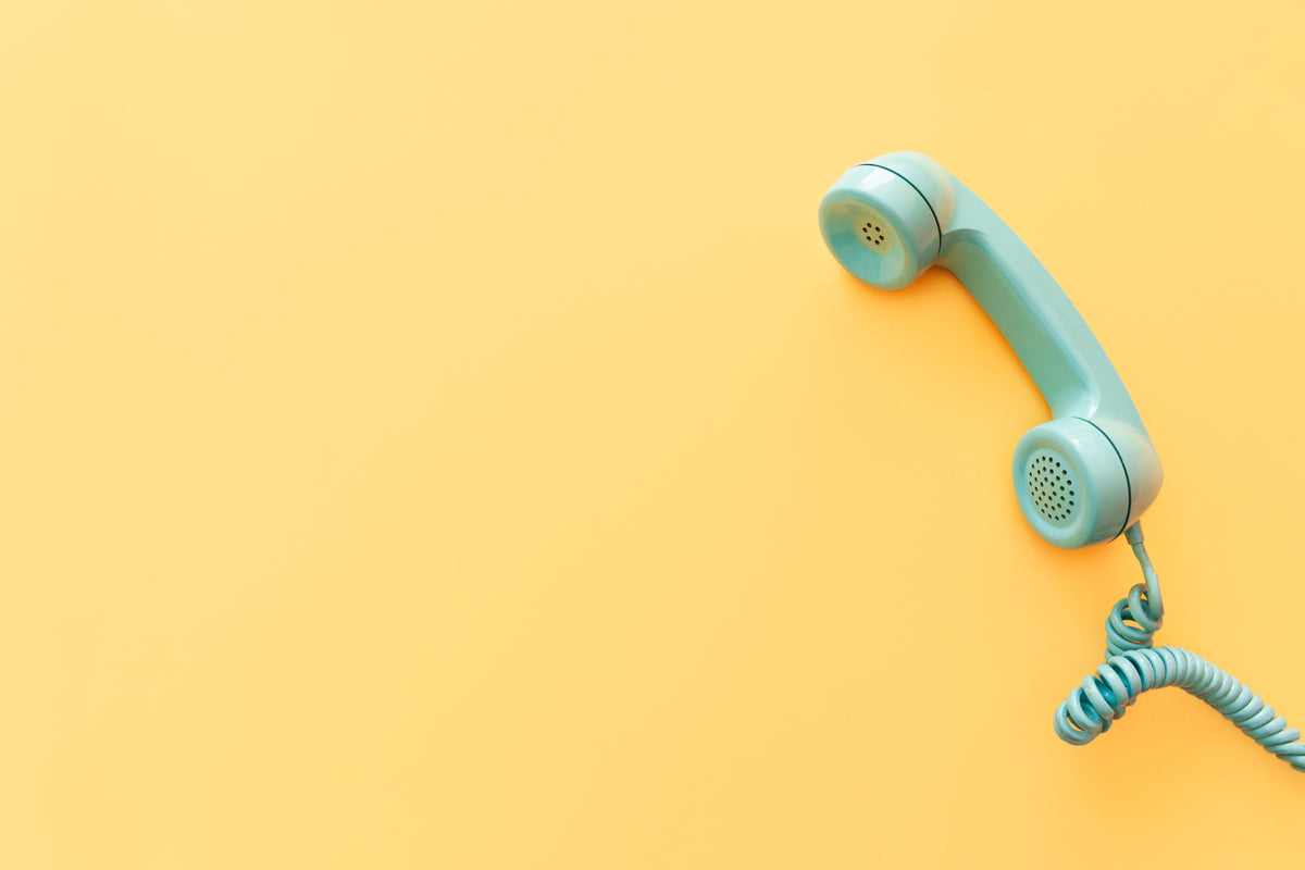 teal phone on yellow