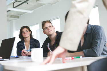 team listens at meeting