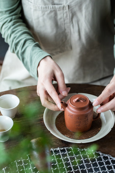 teapot in a womans hands