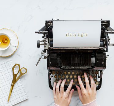 teatime design flat lay with typewriter