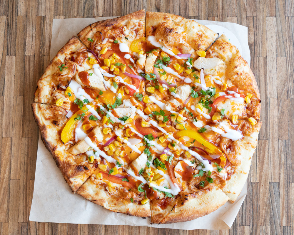 tex mex pizza on cutting board